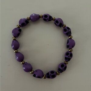 Purple, gold and black Skull Beaded Bracelet-jewelry. Brand new.